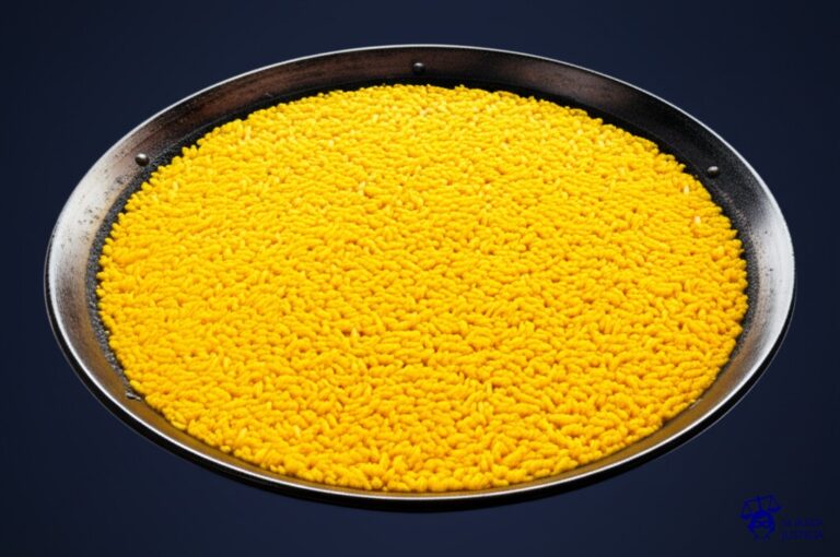 Un gran plato de paella, aparentemente perfecto, con un grano de arroz estratégicamente desplazado, fuera de lugar. Representa: Gol anulado a Rivaldo en el Barcelona vs. Real Madrid (Liga 2001)